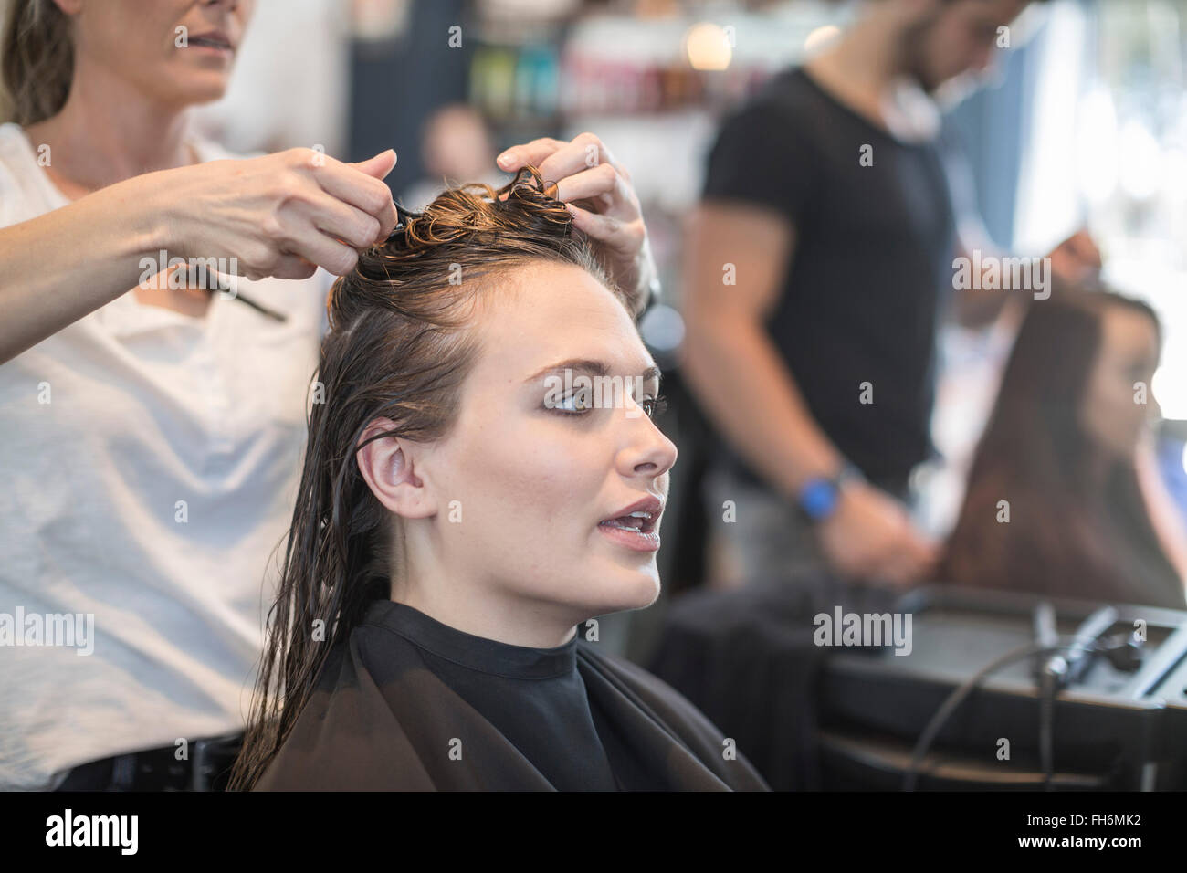 Woman in hair salon getting her hair done Stock Photo - Alamy