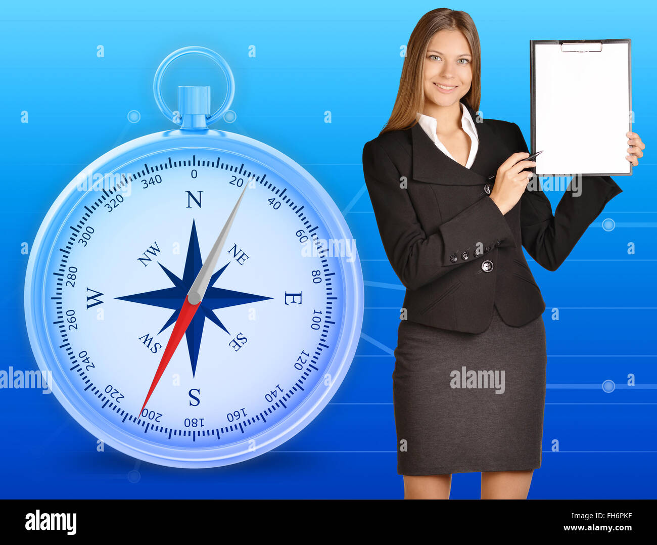 Office girl holding clipboard standing on blue background with compass Stock Photo