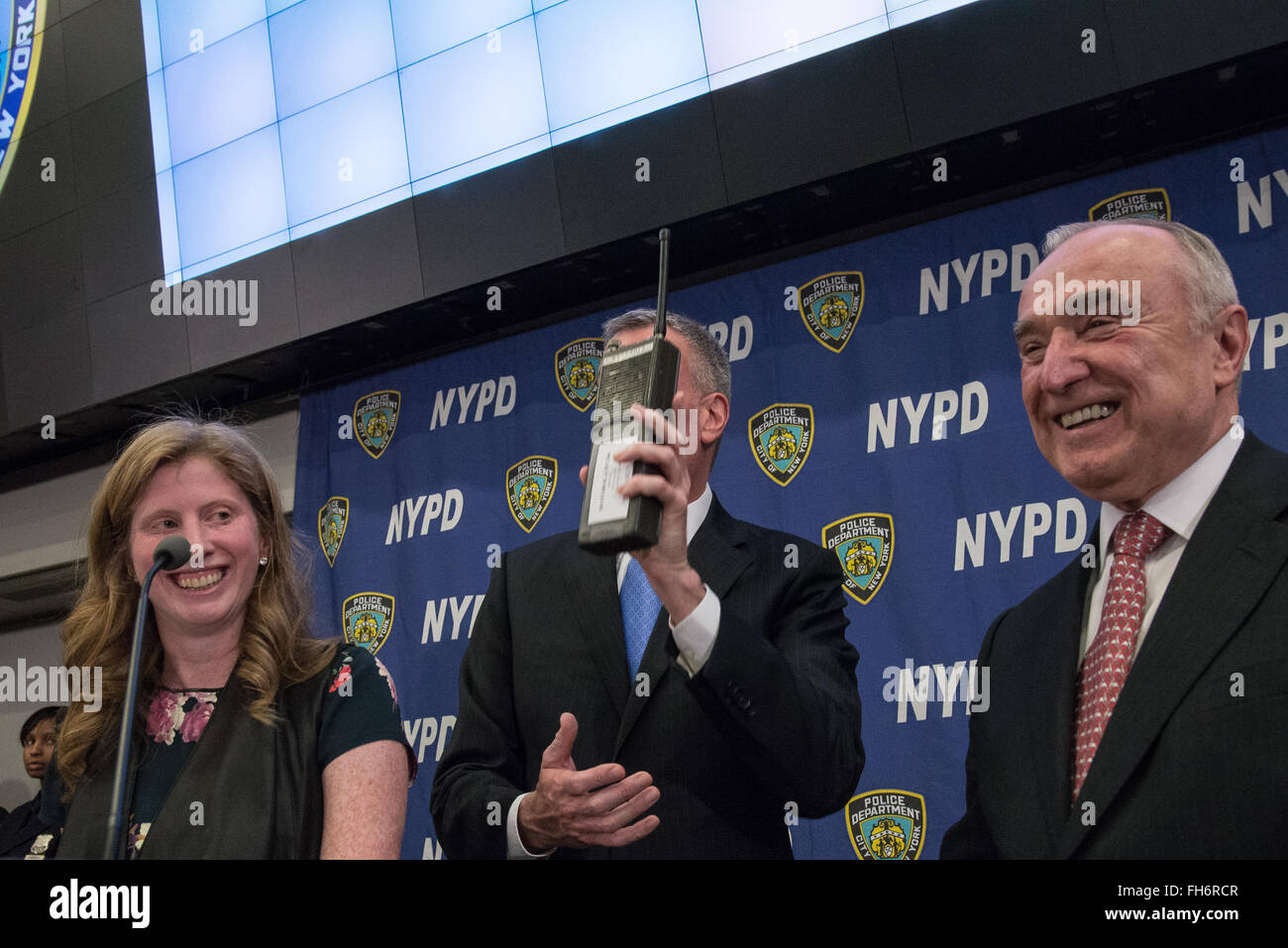 New York, United States. 23rd Feb, 2016. Mayor de Blasio displays an antique police radio which he hands to Commissioner Bratton. NYC Mayor Bill de Blasio and Police Commissioner William Bratton held a press briefing at One Police Plaza, the headquarters of the NYPD, to announce the launch of 'CompStat 2.0,' a new system for both publicly sharing crime data and enabling much accelerated distribution of vital police information resources among officers in the field. Credit:  Albin Lohr-Jones/Pacific Press/Alamy Live News Stock Photo