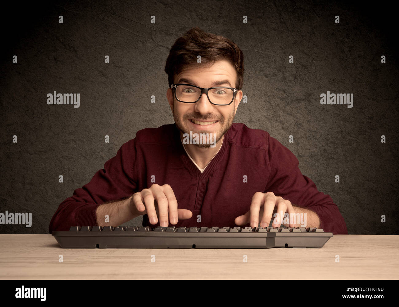 Computer geek typing on keyboard Stock Photo - Alamy