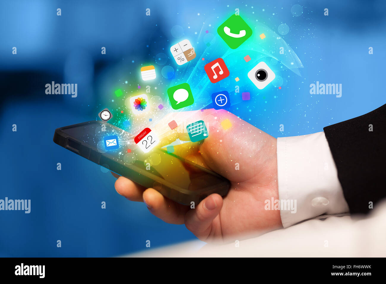Hand holding smartphone with colorful app icons Stock Photo - Alamy