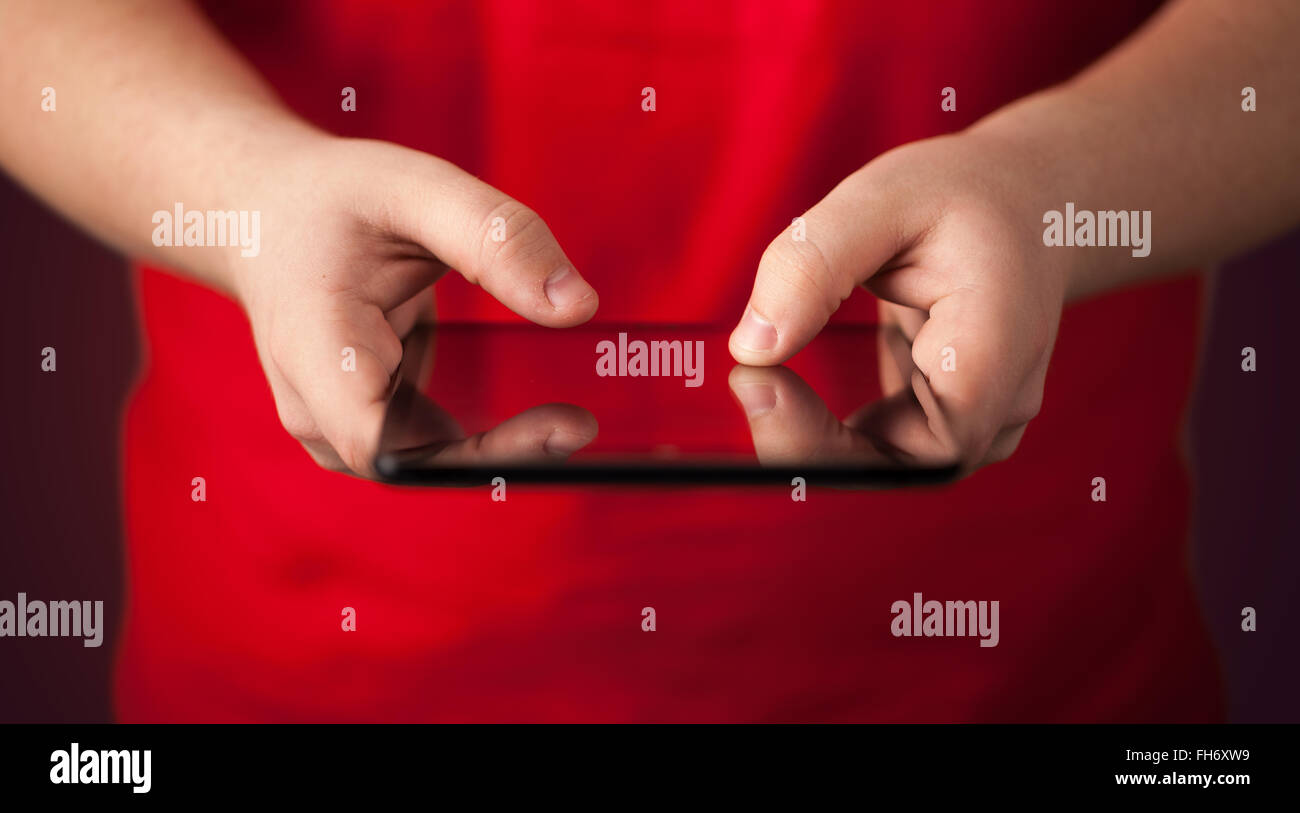 Close up of hand holding digital touchpad tablet device Stock Photo Alamy