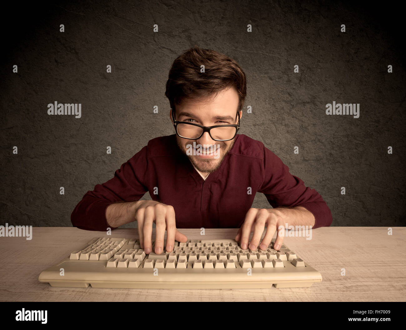 Computer geek typing on keyboard Stock Photo - Alamy