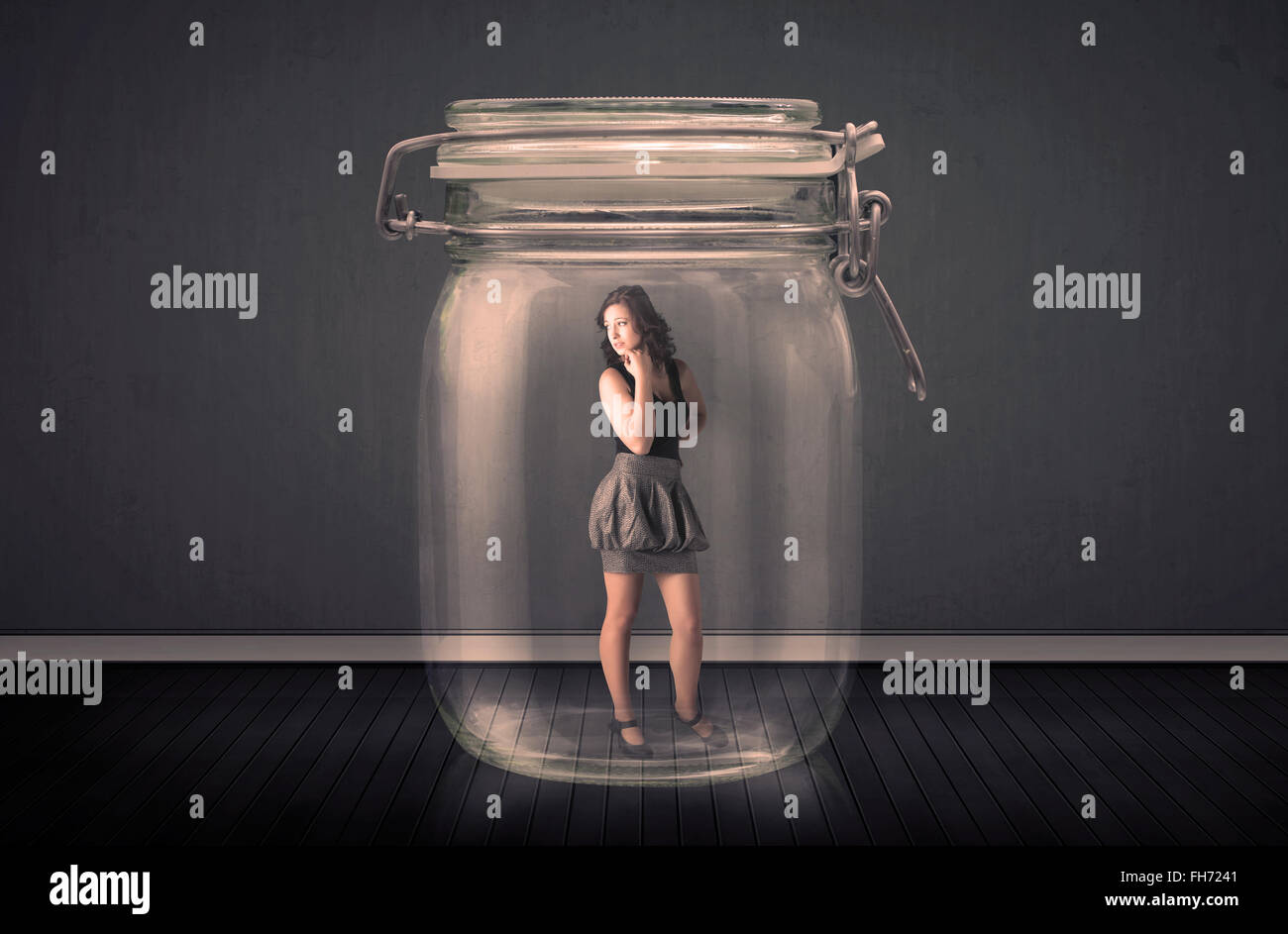 Trapped In Glass Businesswoman trapped into a glass jar concept Stock Photo - Alamy