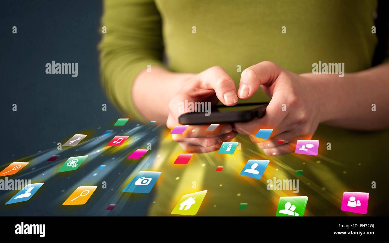 Man holding smartphone with technology application icons Stock Photo ...
