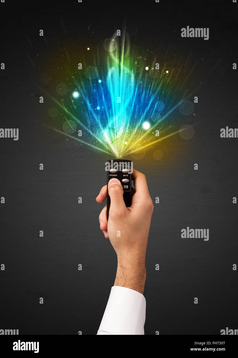 Hand with remote control and explosive signal Stock Photo - Alamy