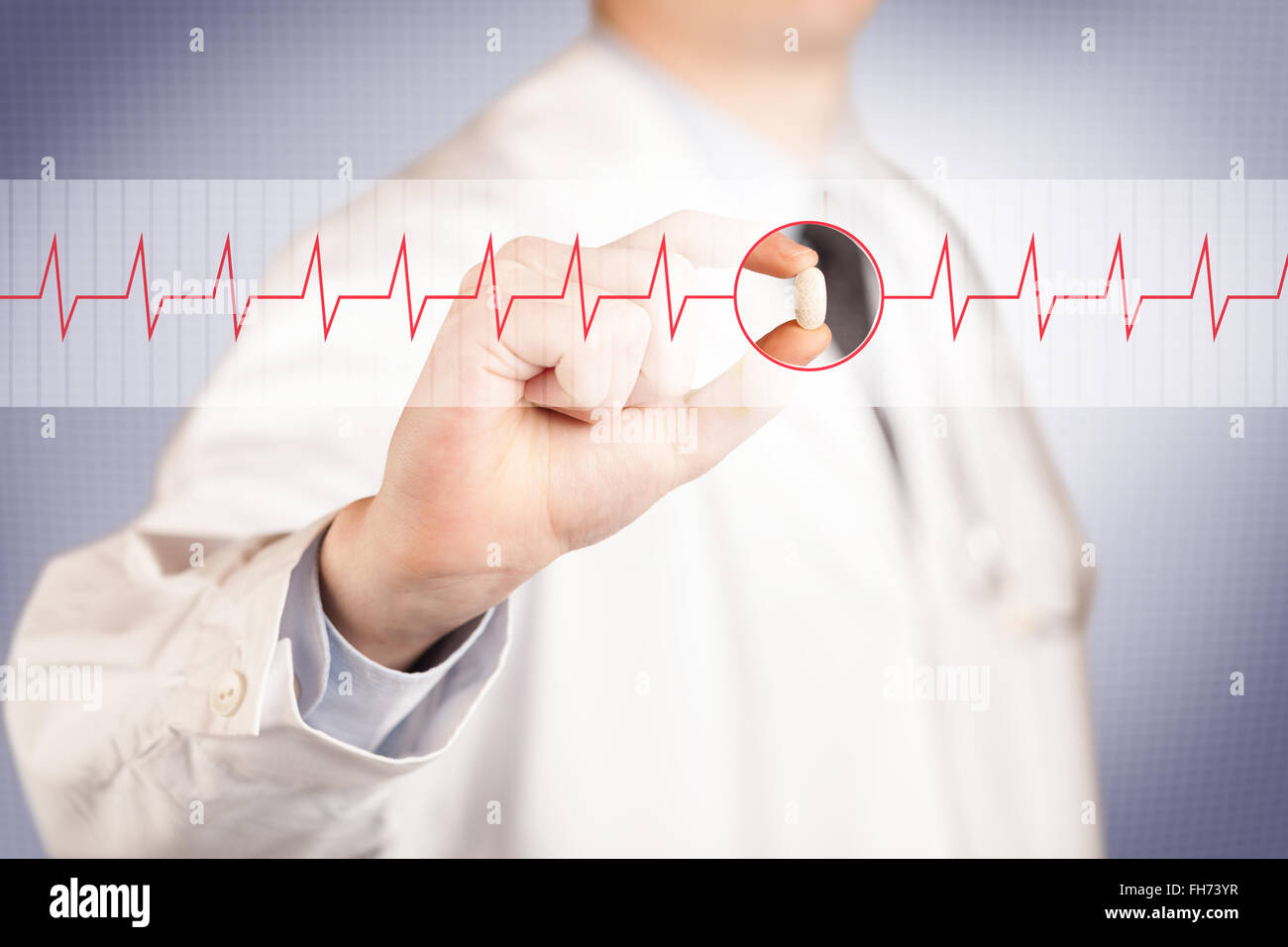 A doctor holding a heart pill Stock Photo - Alamy
