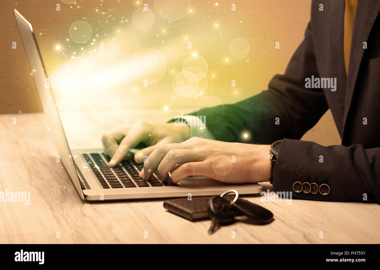 Businessman working fast on laptop Stock Photo - Alamy