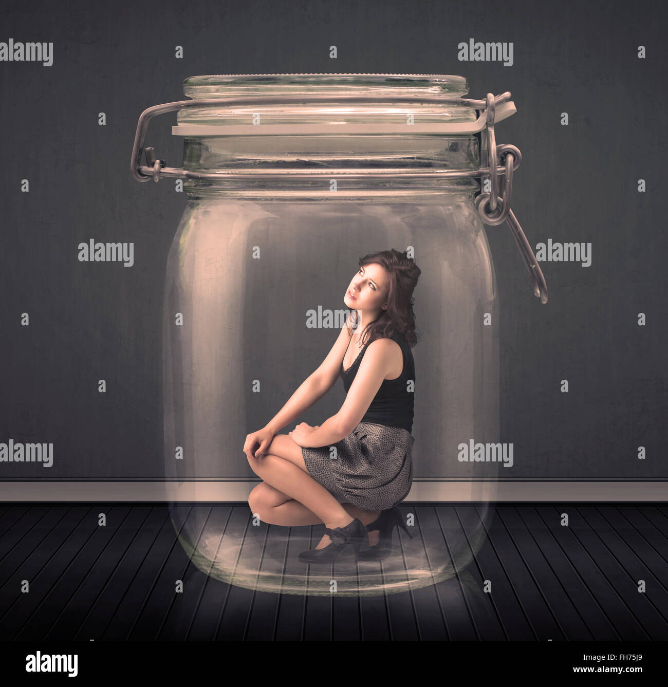 Trapped In Glass Businesswoman trapped into a glass jar concept Stock Photo - Alamy