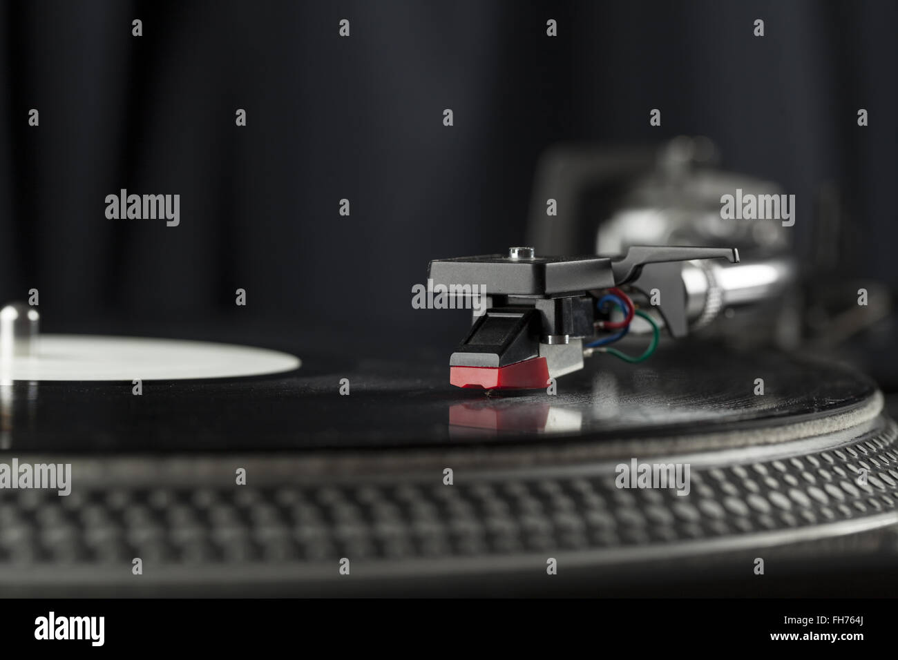 Turntable playing vinyl close up with needle on the record Stock Photo ...