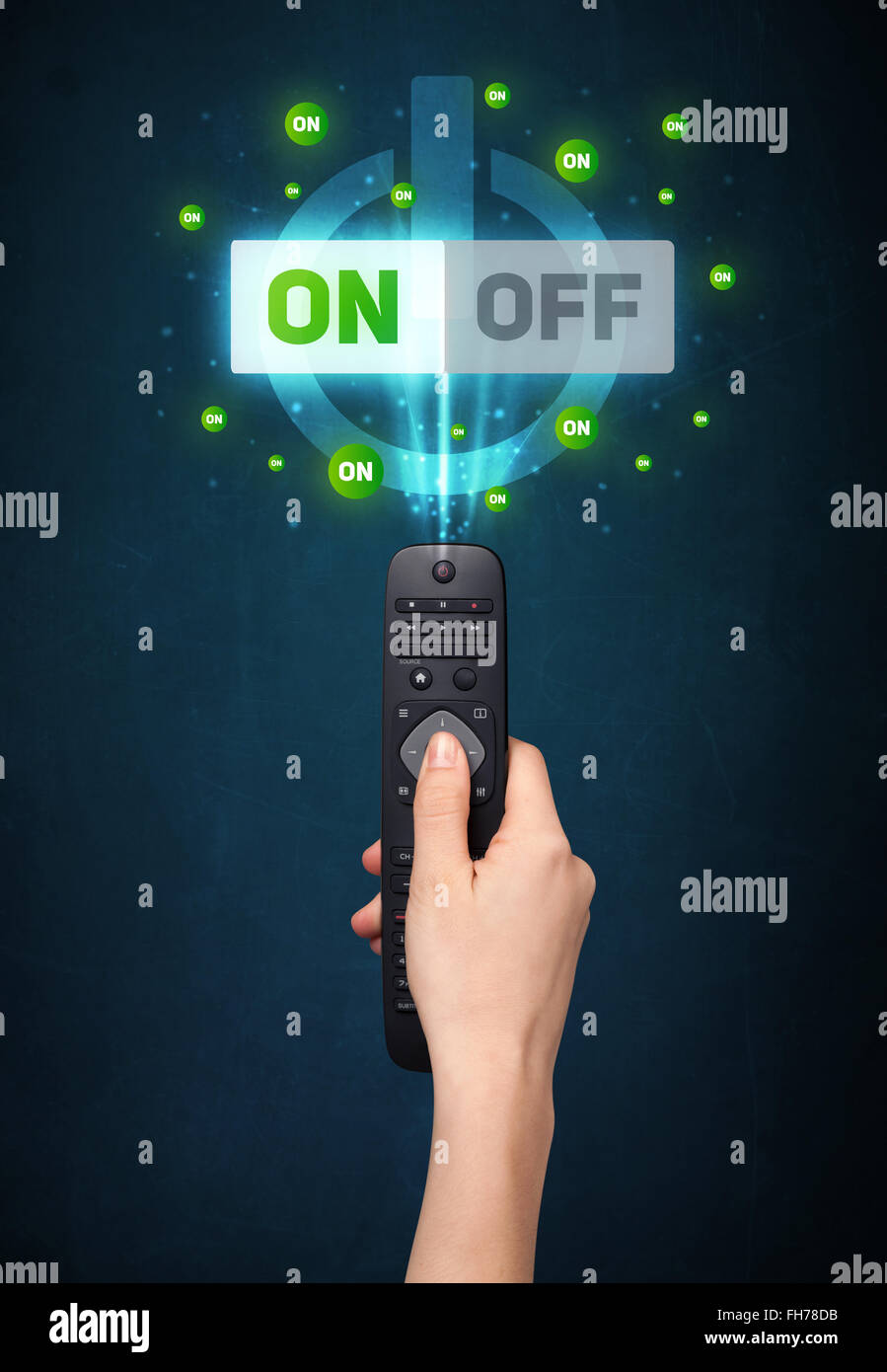 Hand with remote control and on-off signals Stock Photo - Alamy