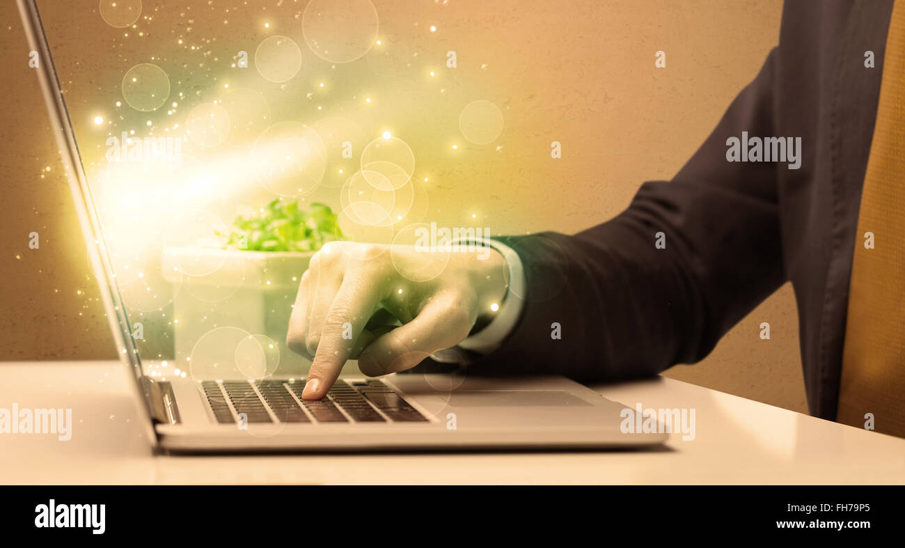 Businessman working fast on laptop Stock Photo - Alamy