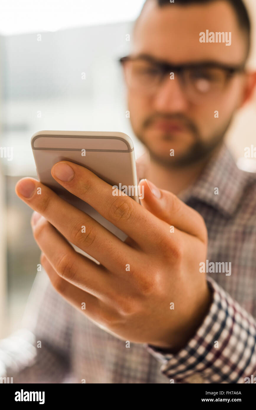 Close-up of man holding smarthone Stock Photo