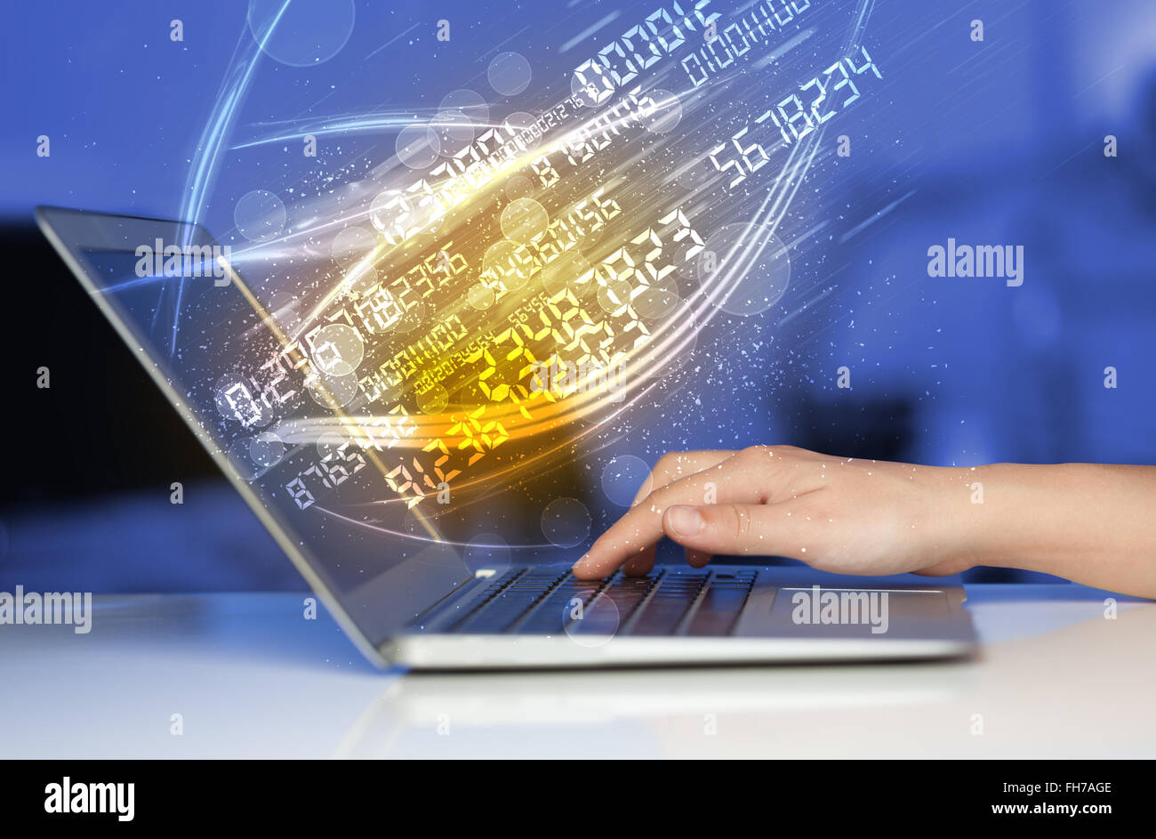 Man typing on modern notebook with number technology data coming out ...