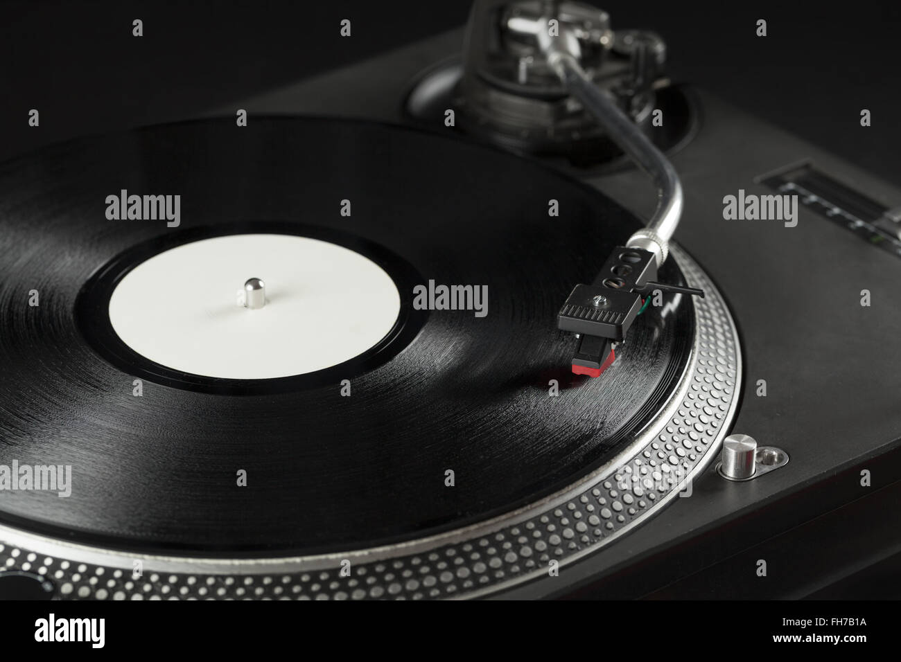 Turntable playing vinyl close up with needle on the record Stock Photo ...