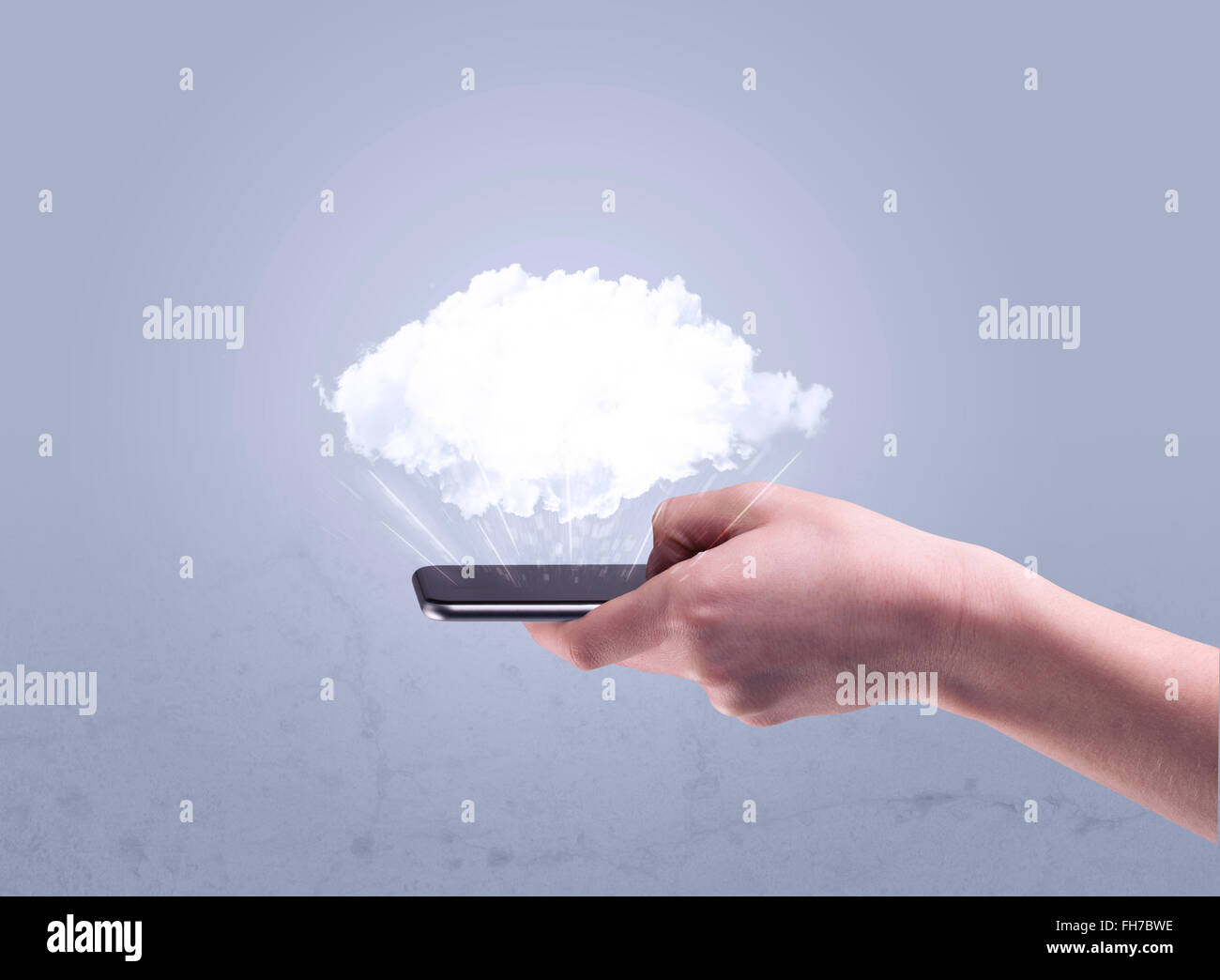 Hand holding phone with empty cloud Stock Photo - Alamy
