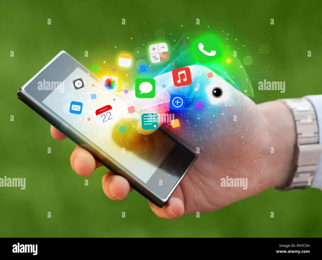 Hand holding smartphone with colorful app icons Stock Photo - Alamy