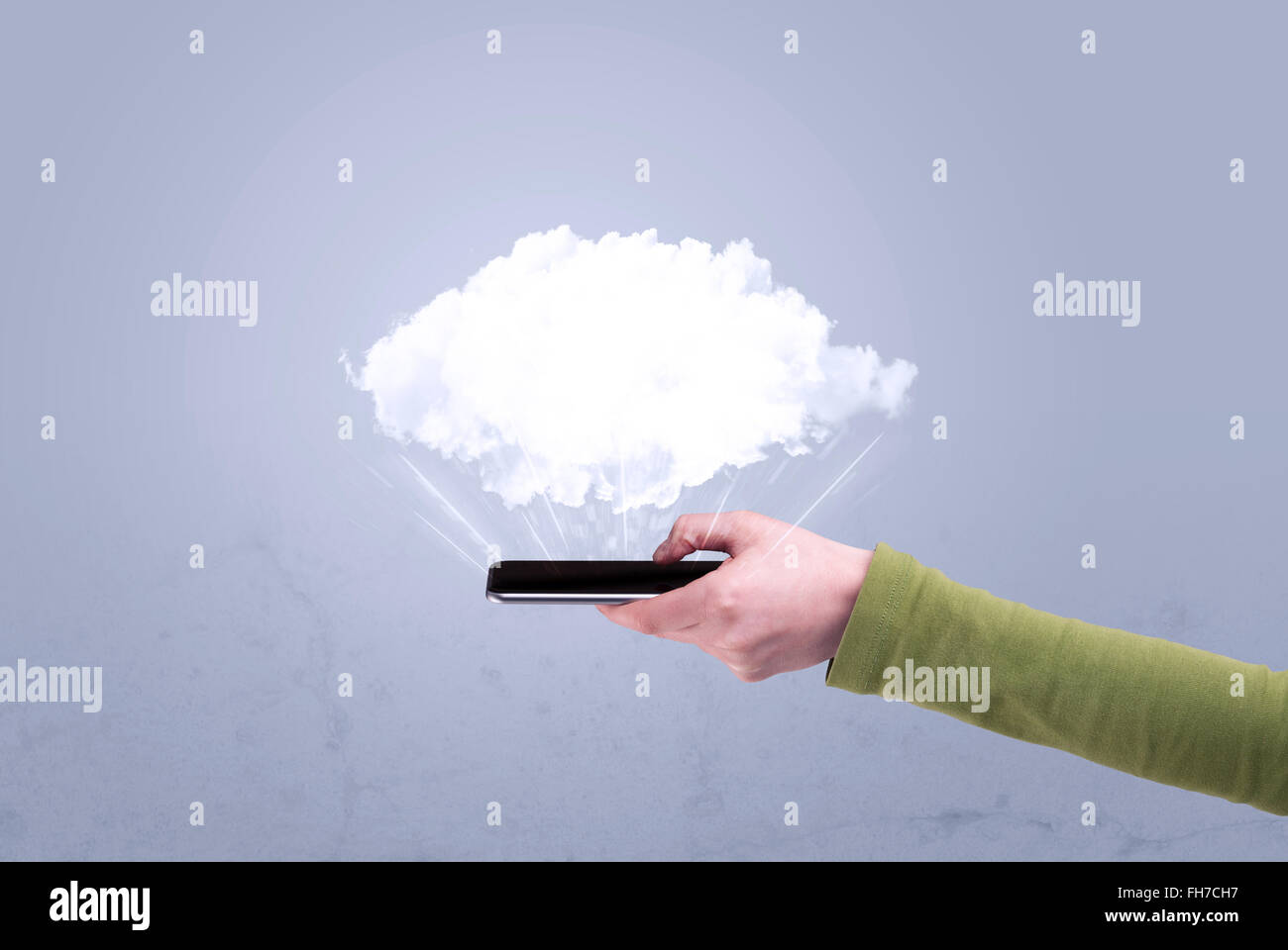 Hand holding phone with empty cloud Stock Photo - Alamy