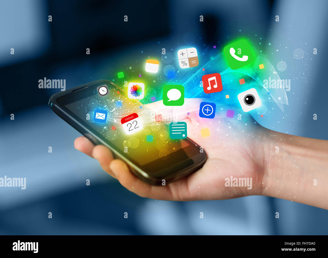Hand holding smartphone with colorful app icons Stock Photo - Alamy