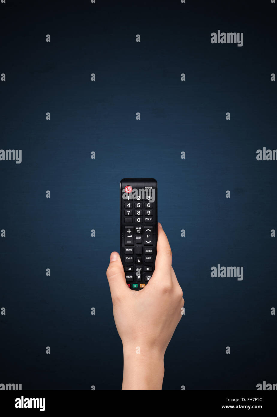 Hand with remote control Stock Photo Alamy