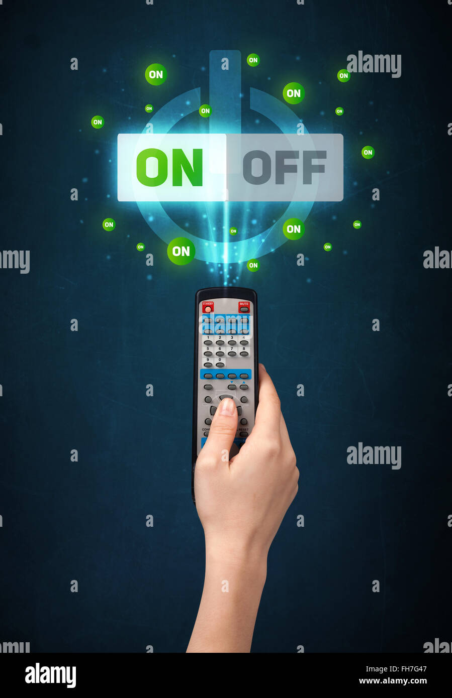Hand with remote control and on-off signals Stock Photo - Alamy