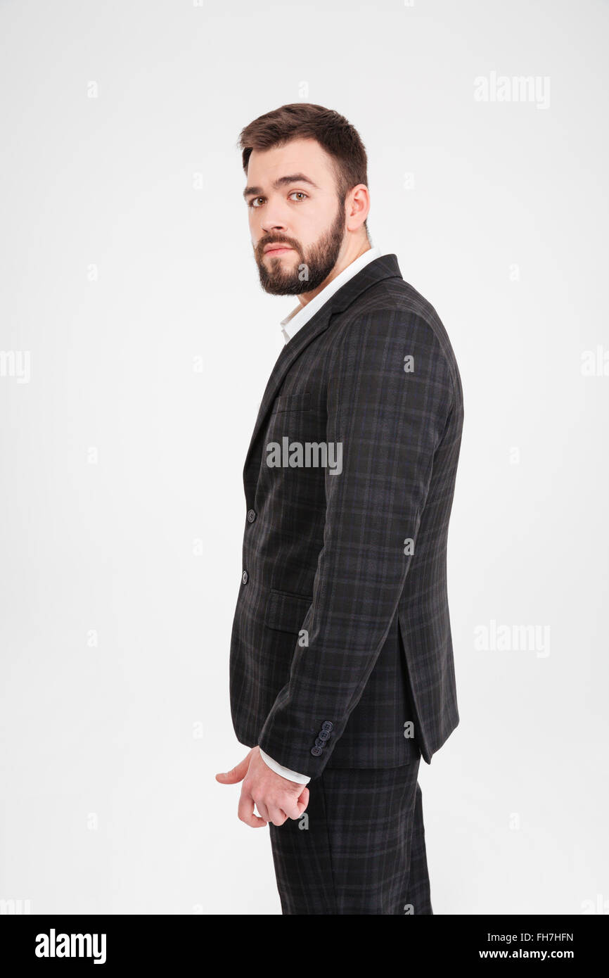 Serious businessman looking at camera isolated on a white background ...