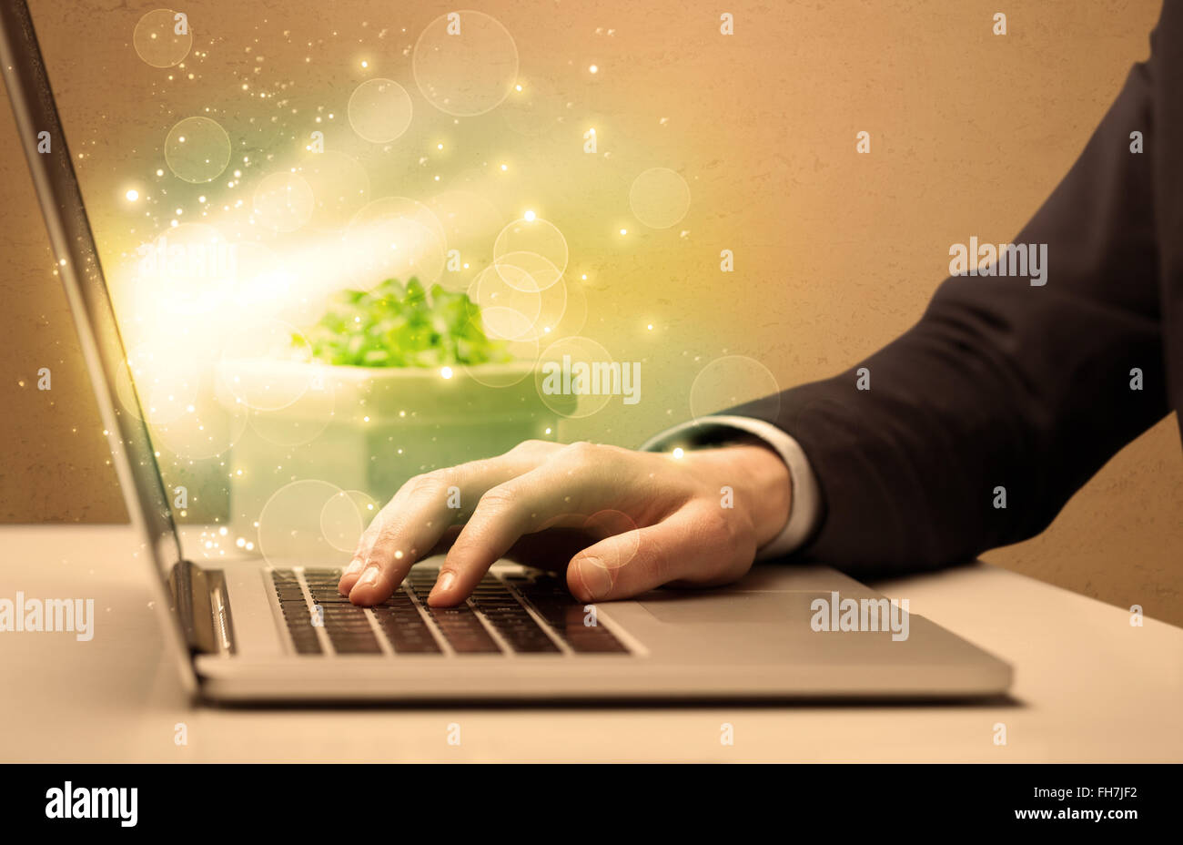 Businessman working fast on laptop Stock Photo - Alamy