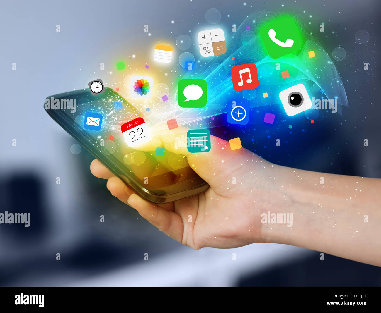 Hand holding smartphone with colorful app icons Stock Photo - Alamy