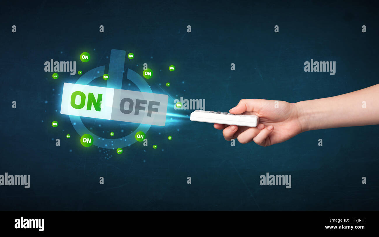 Hand with remote control and on-off signals Stock Photo - Alamy