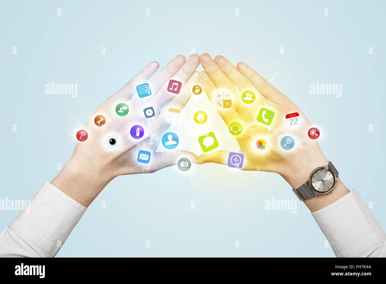 Hands creating a form with mobile app icons Stock Photo - Alamy