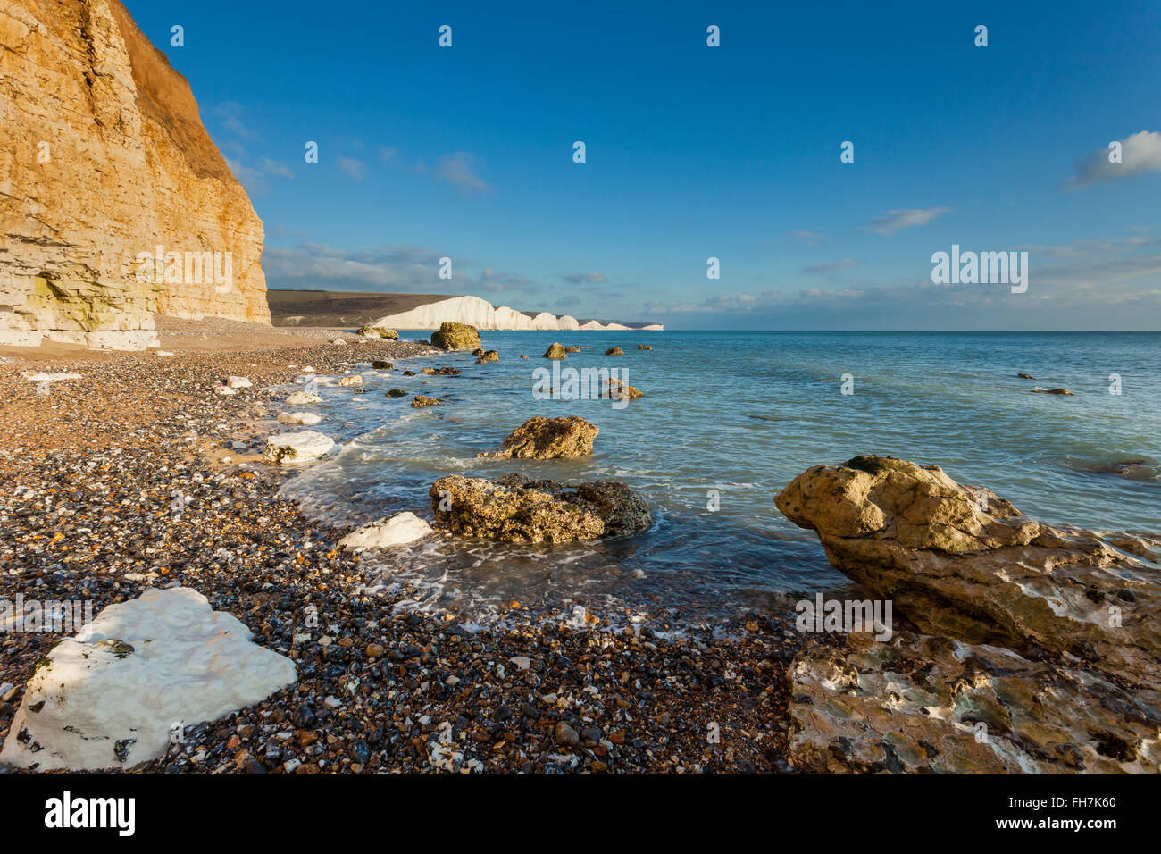 Hope Gap on the coast of East Sussex, England. Iconic chalky cliffs of Seven Sisters in the distance. Stock Photo