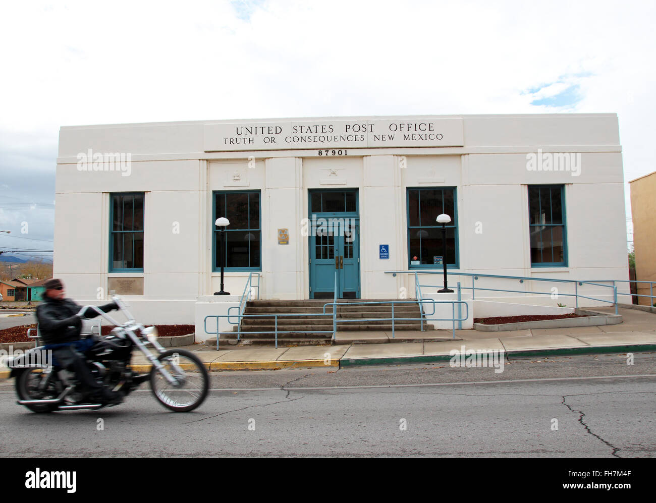A motorcylce rides past the post office in the town of Truth or Consequences, New Mexico, USA, 26 November 2016. In 1950 the town re-named itself after the quiz show Truth or Consequences. Photo: Christina Horsten/dpa Stock Photo