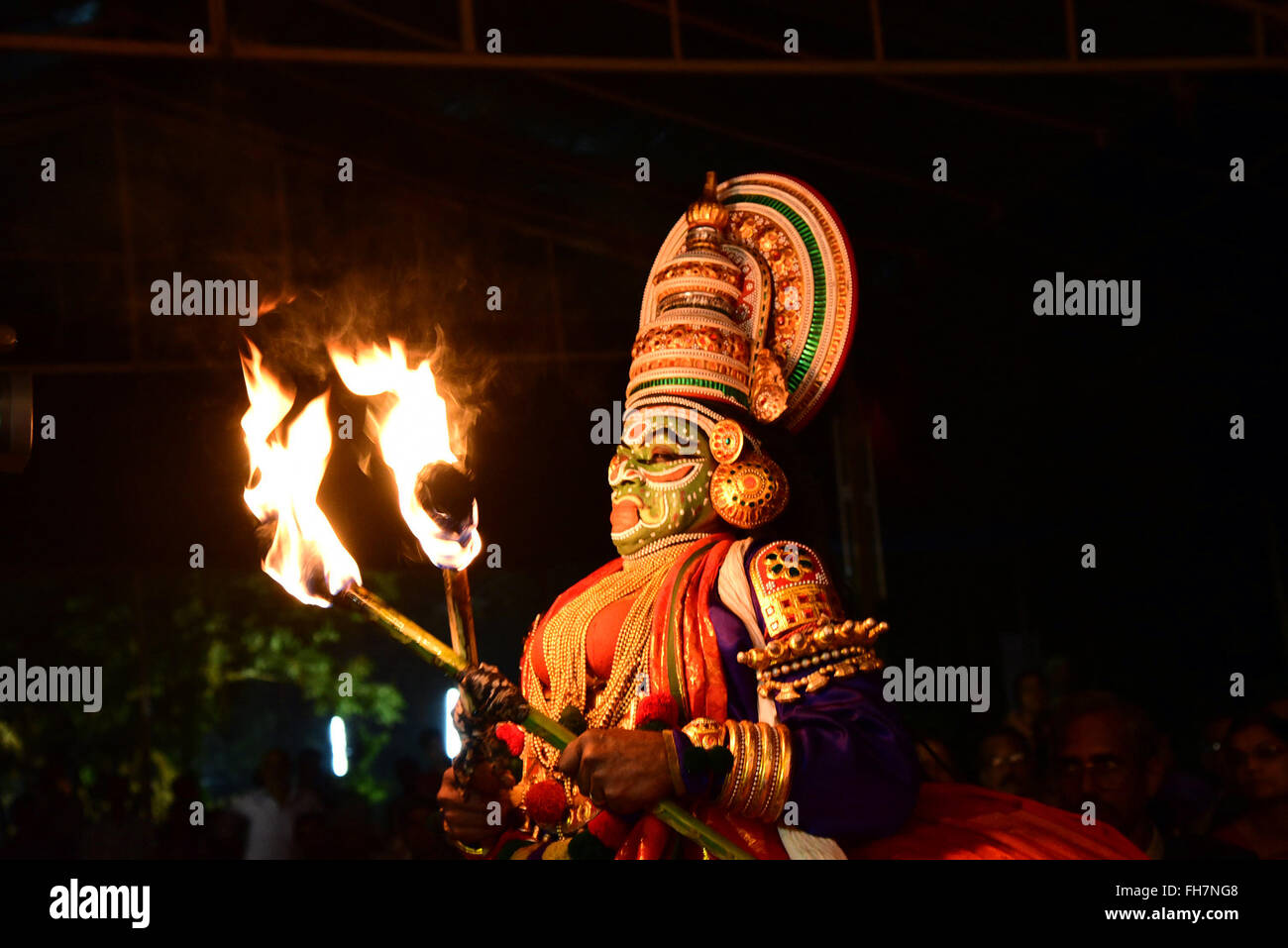 Kathakali is a stylized classical Indian dance-drama noted for the attractive make-up of characters, elaborate costumes. Stock Photo