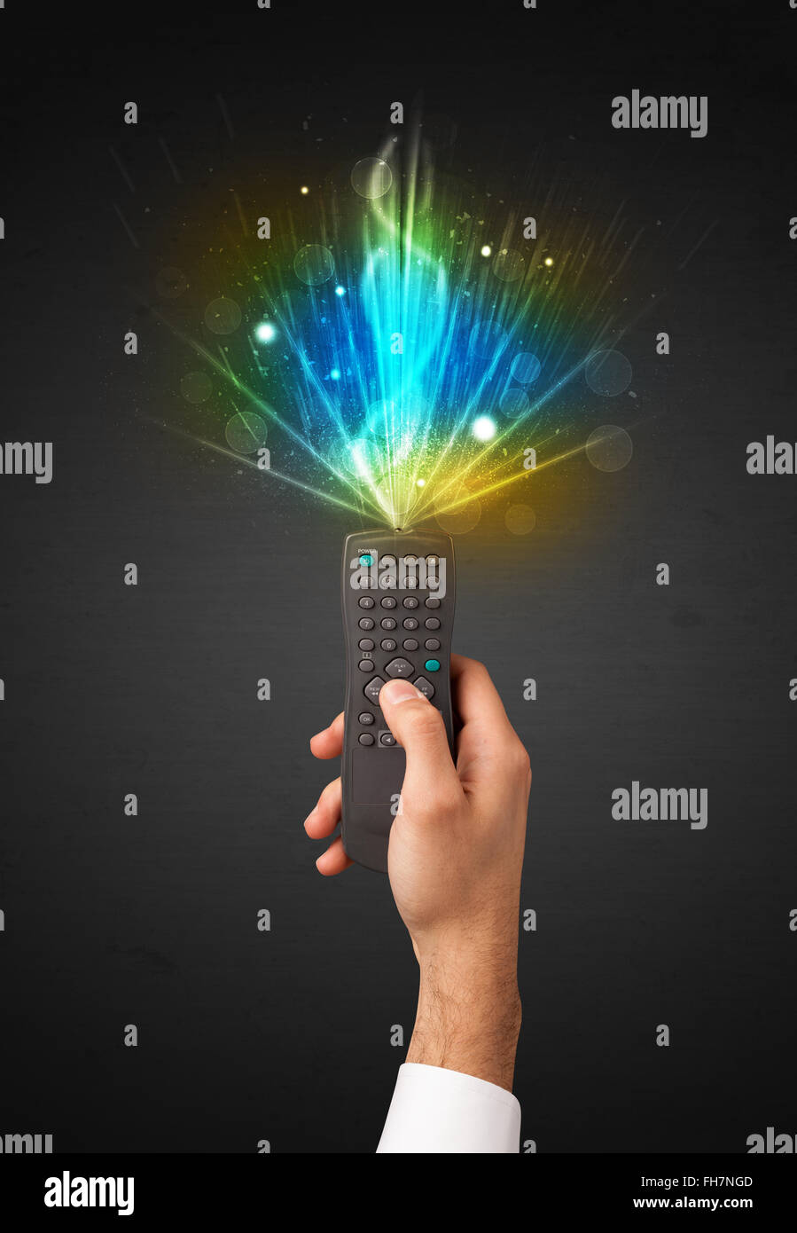 Hand with remote control and explosive signal Stock Photo - Alamy