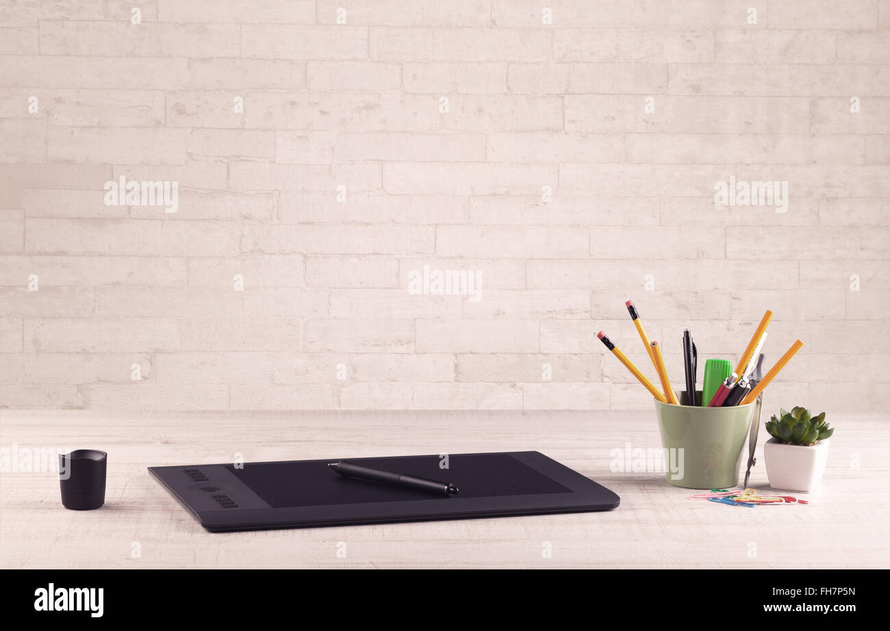 Office Desk Closeup With White Brick Wall Stock Photo 96672065