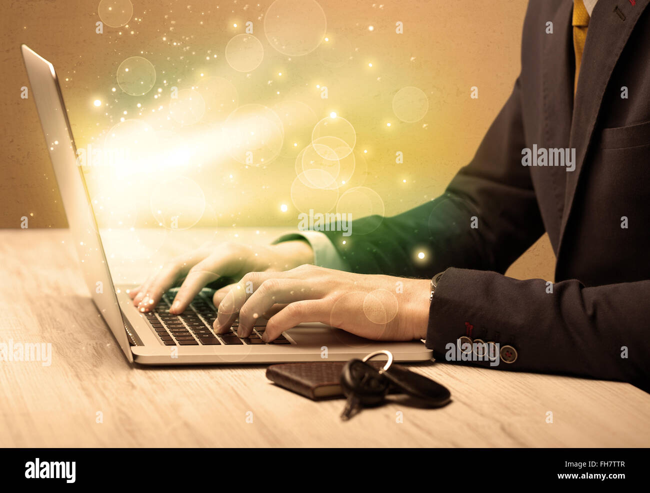 Businessman working fast on laptop Stock Photo - Alamy