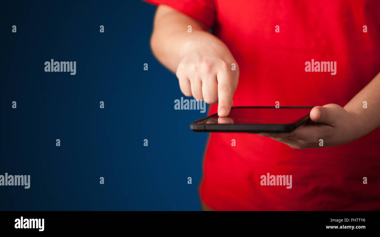 Close up of hand holding digital touchpad tablet device Stock Photo Alamy