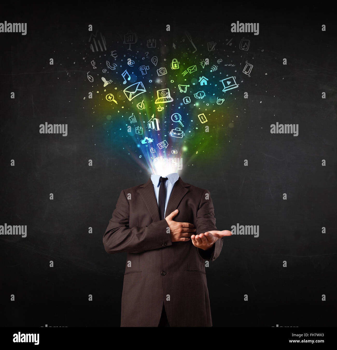 Business man with glowing media icons exploding head Stock Photo - Alamy