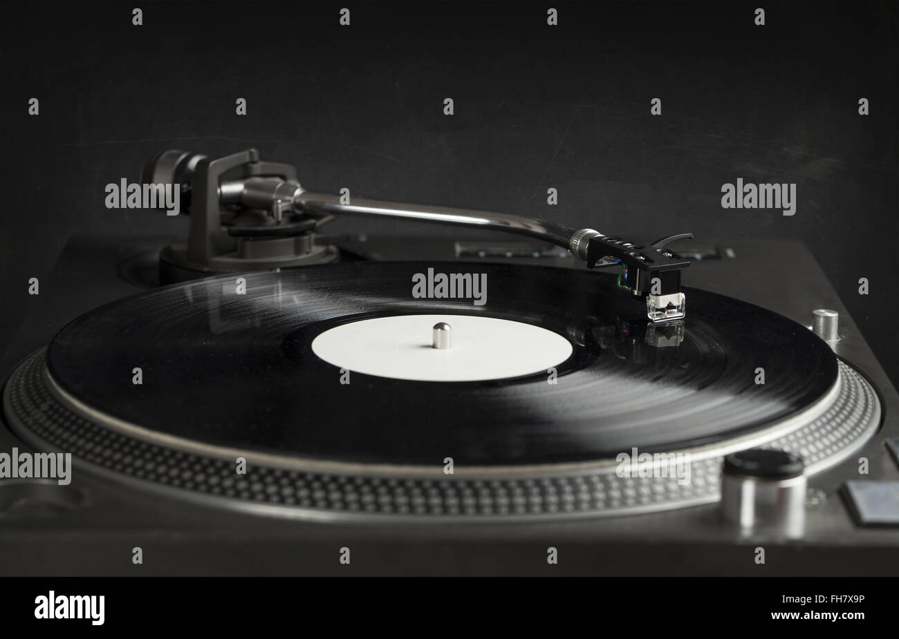 Turntable playing vinyl close up with needle on the record Stock Photo ...