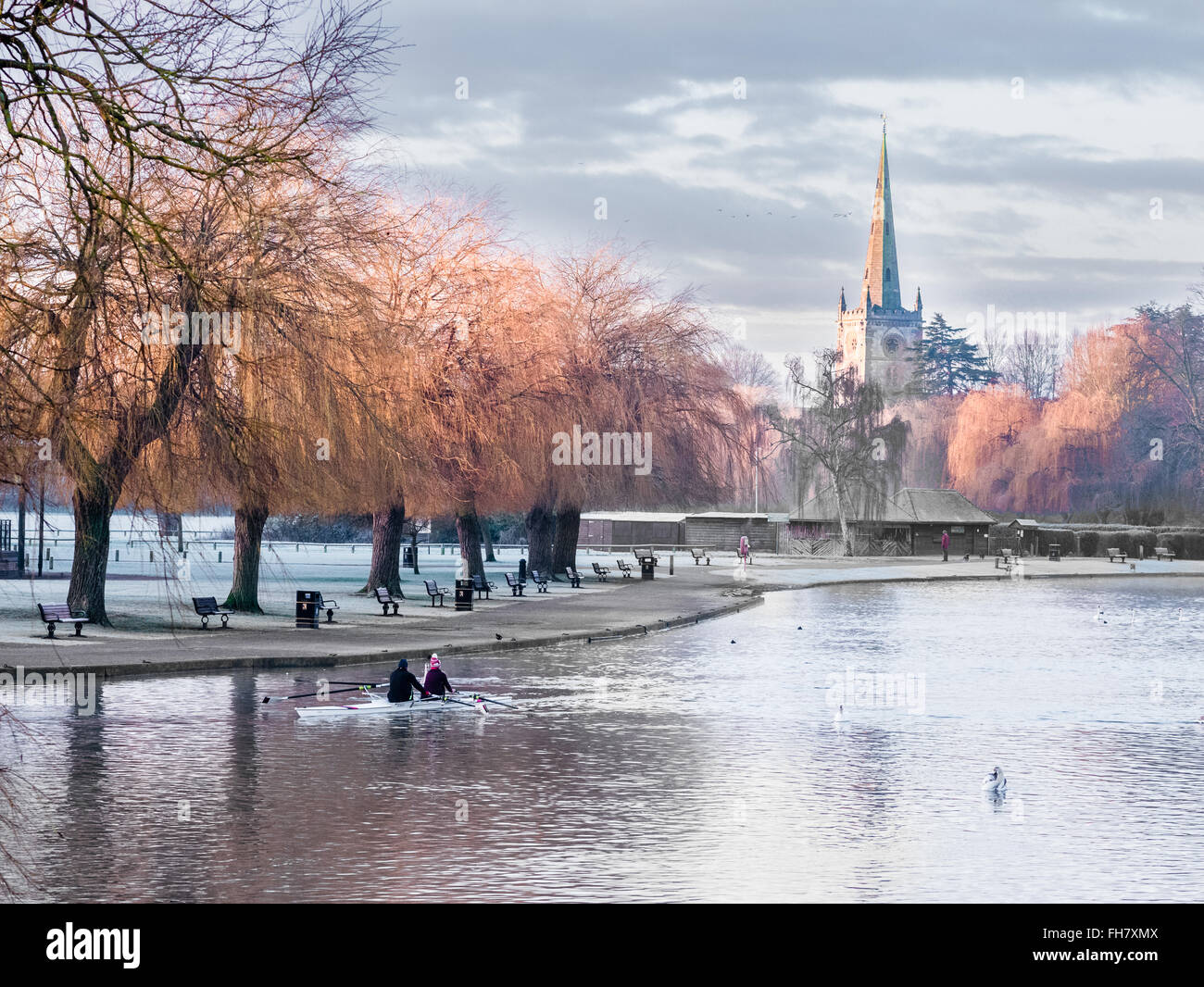 Morning frost on the river Avon at Stratford, with Holy Trinity church in the centre. Stock Photo