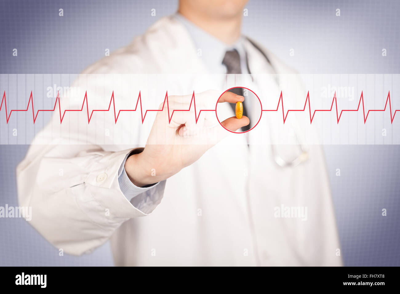 A doctor holding a heart pill Stock Photo - Alamy
