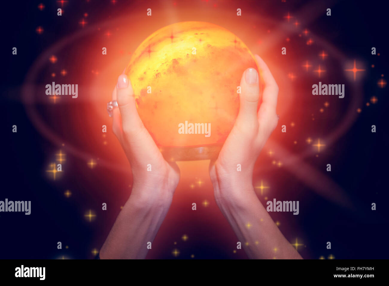 Composite image of fortune teller holding crystal ball Stock Photo - Alamy