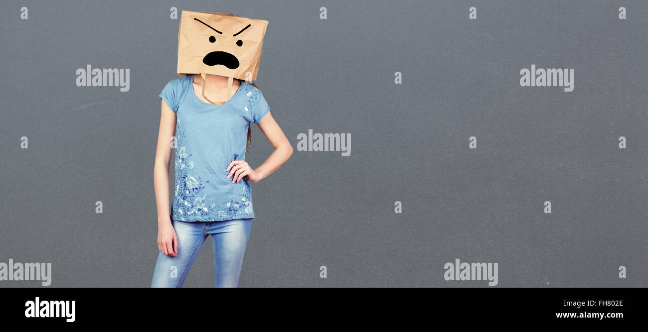 Composite image of woman posing with bag on head Stock Photo Alamy