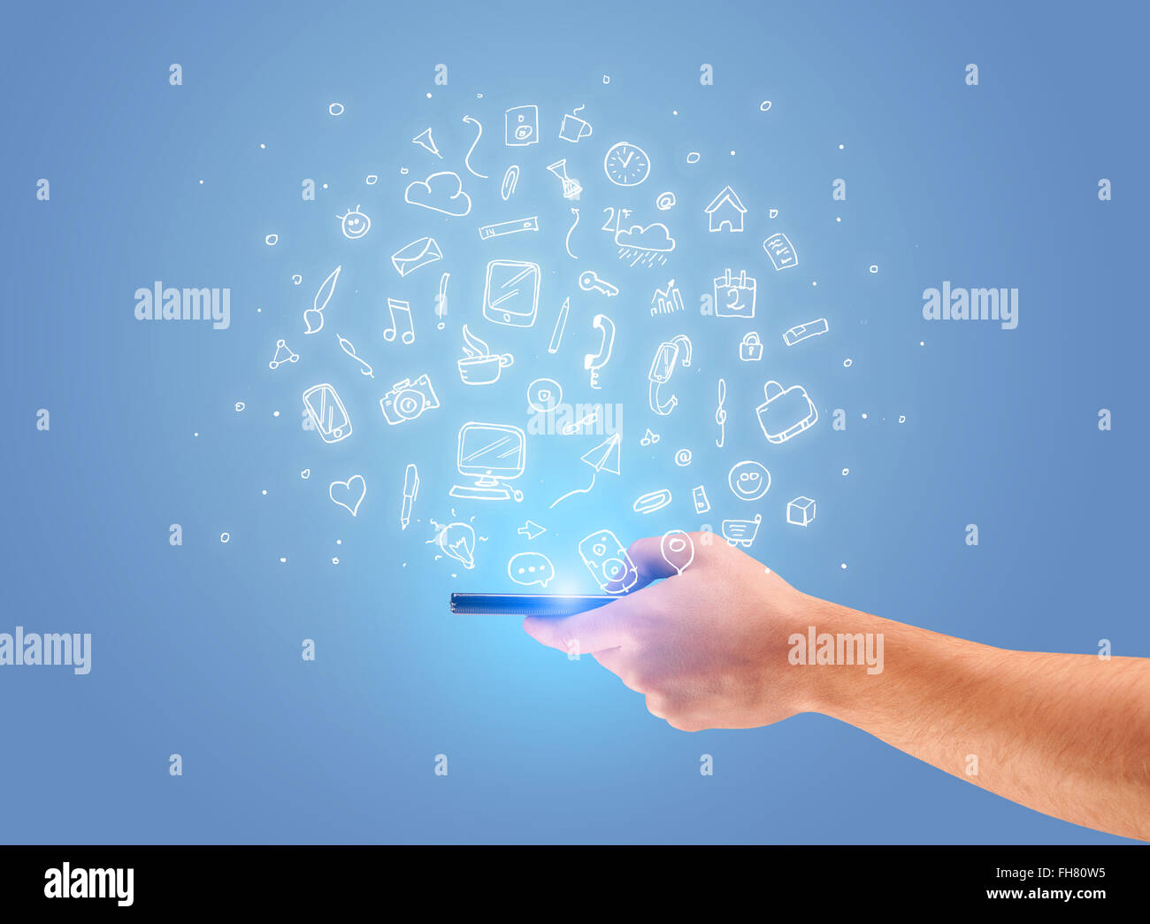 Hand with phone and drawn office icons Stock Photo - Alamy