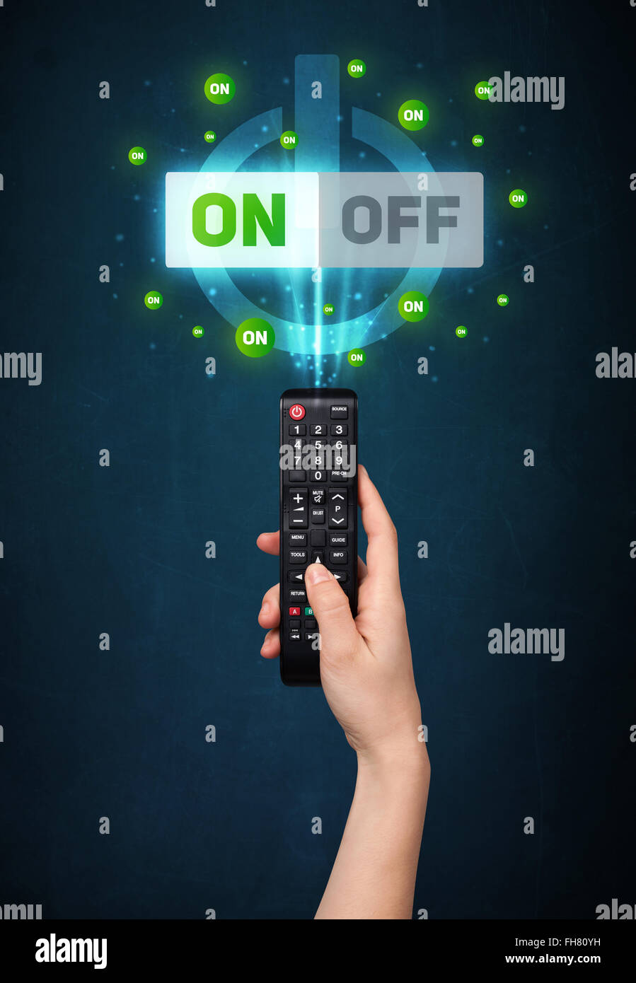 Hand with remote control and on-off signals Stock Photo - Alamy