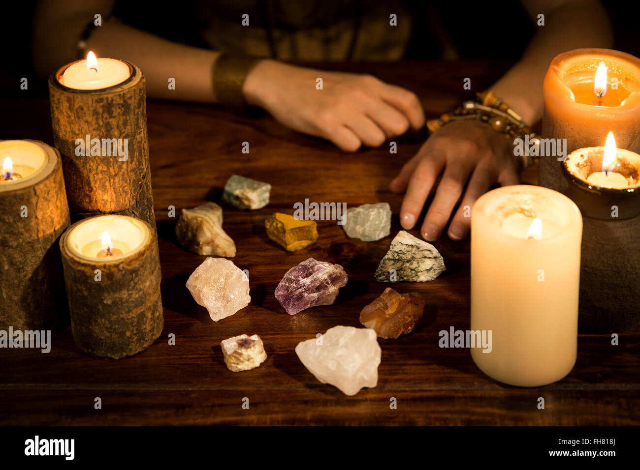 a lot of healing stones, candles and fortune teller hands, concept life
