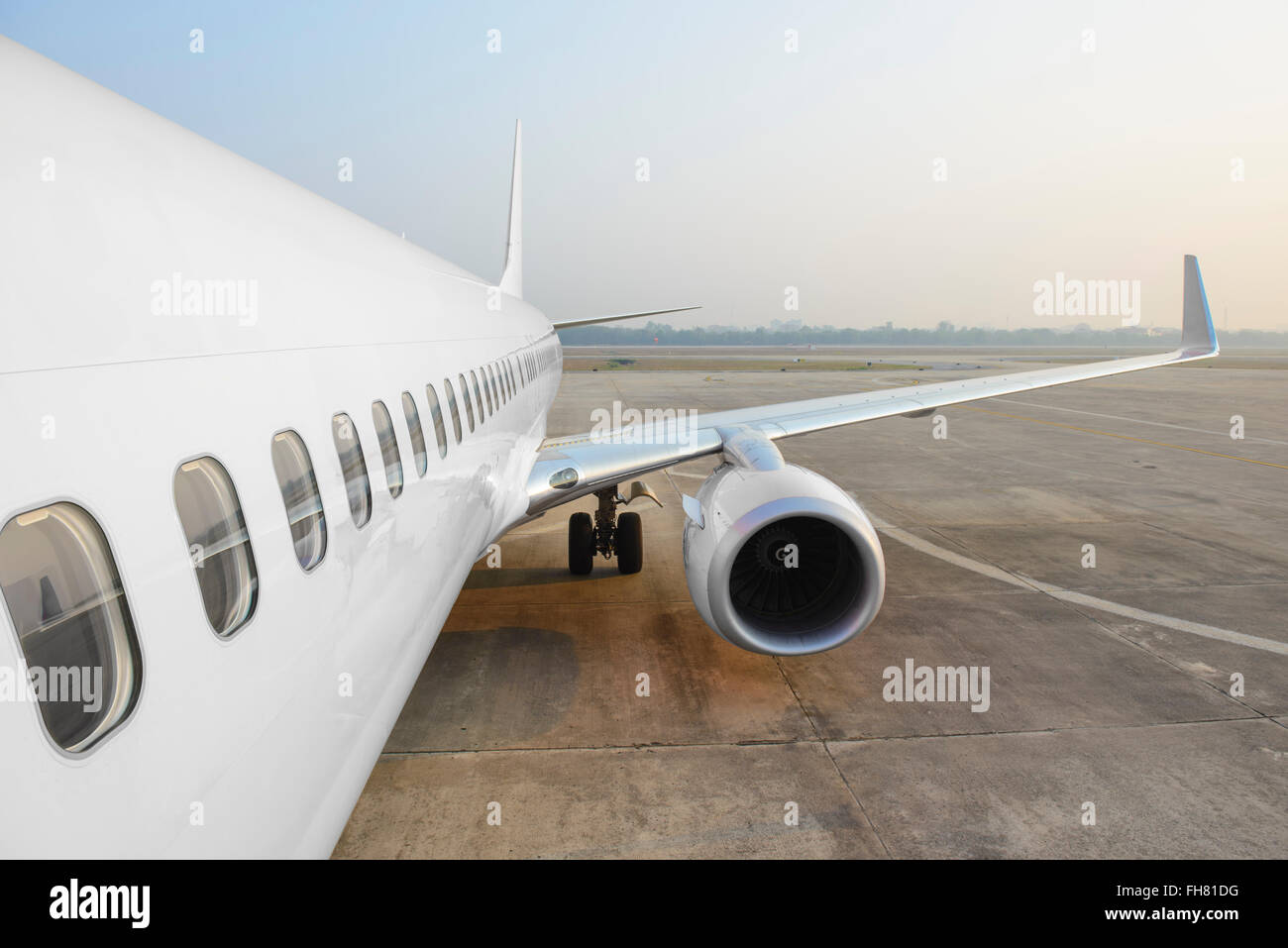 Detail of commercial airplane wing and engine Stock Photo
