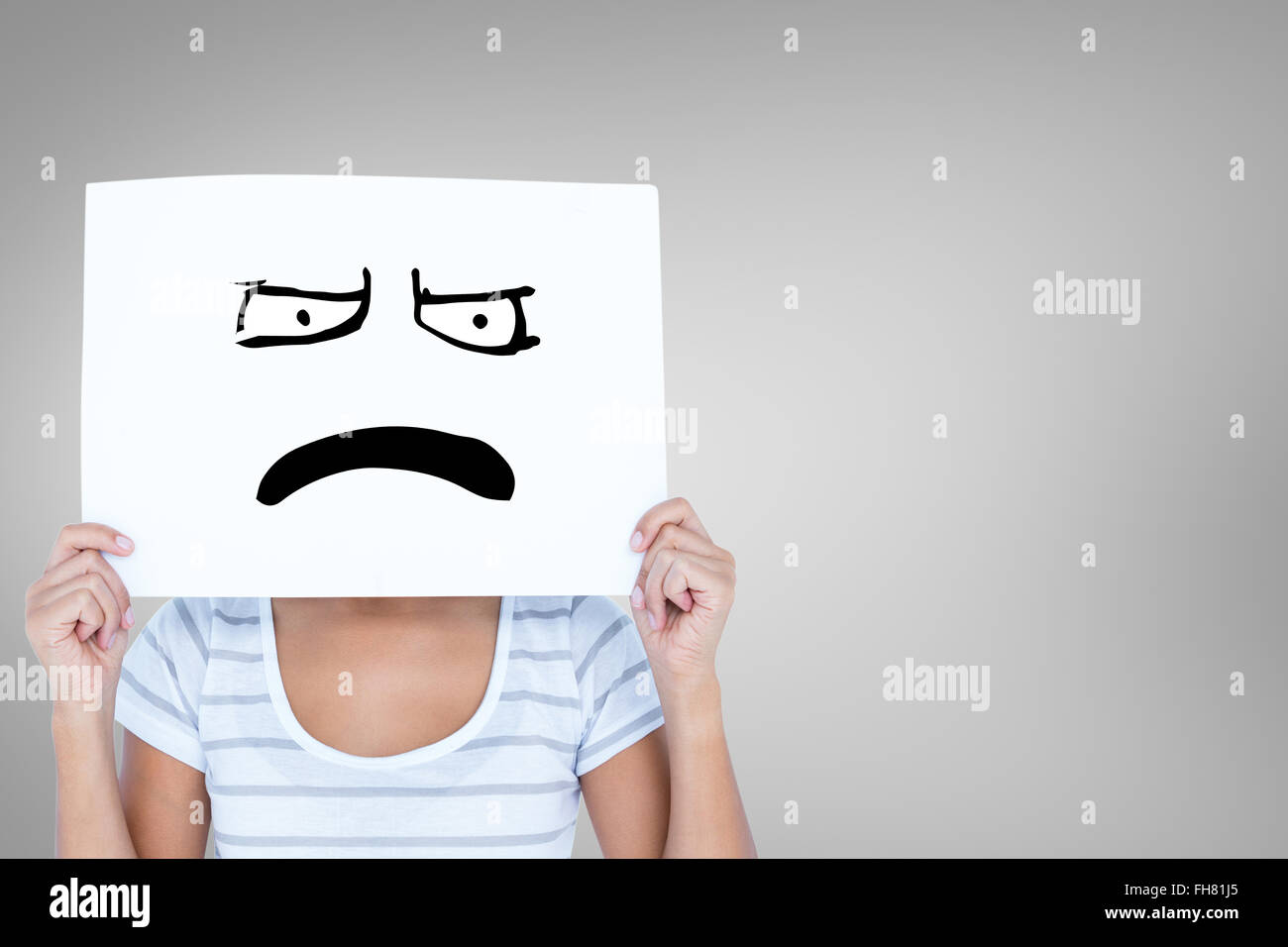 Composite image of woman holding blank sign in front of face Stock ...