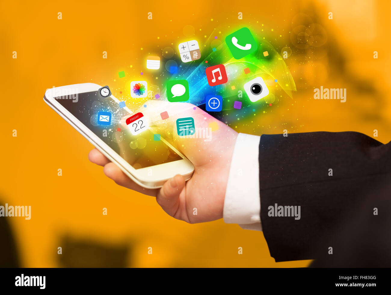 Hand holding smartphone with colorful app icons Stock Photo - Alamy