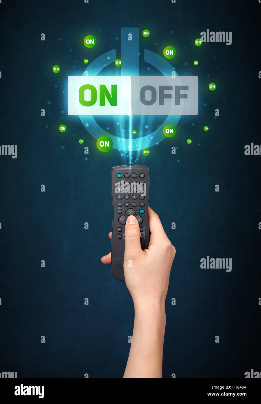 Hand with remote control and on-off signals Stock Photo - Alamy